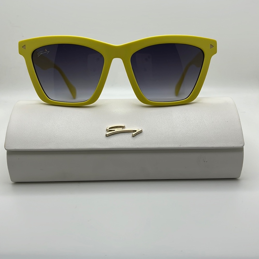 Authentic GENNY yellow Sunglasses. with a bright crystal in front of the lens.